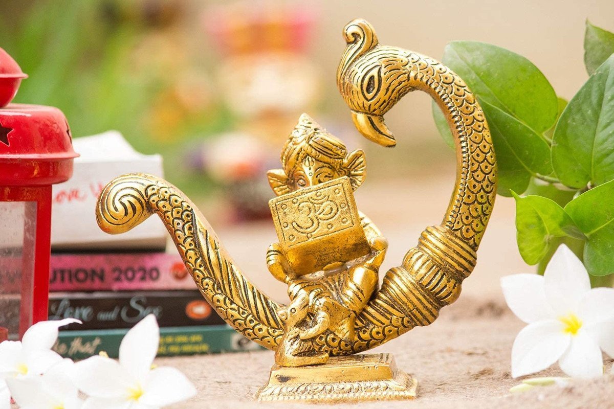 Reading Ganesha Idol on Peacock Brass Finish Ganpati Statue with Book and Om Symbol for Home Decor, Office Desk & Gift 6 Inch