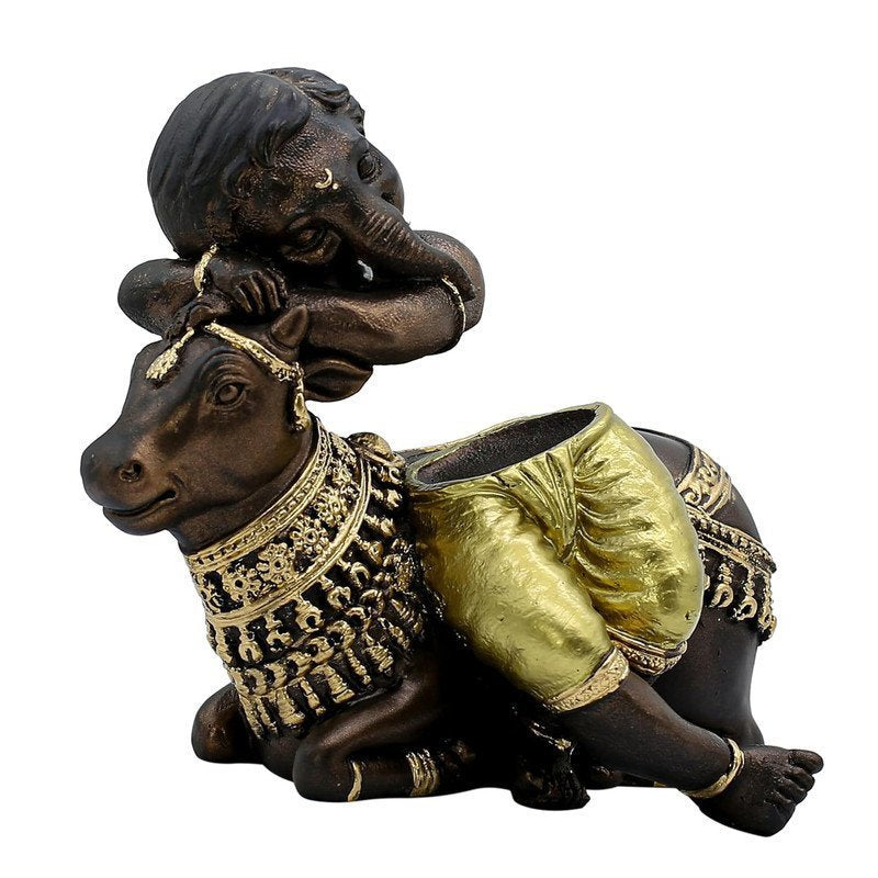 Baby Ganesha Idol Resting on Cow Antique Finish Polyresin Ganpati Murti with Golden Dhoti for Home Decor, Pooja Room & Gift, 6 Inch